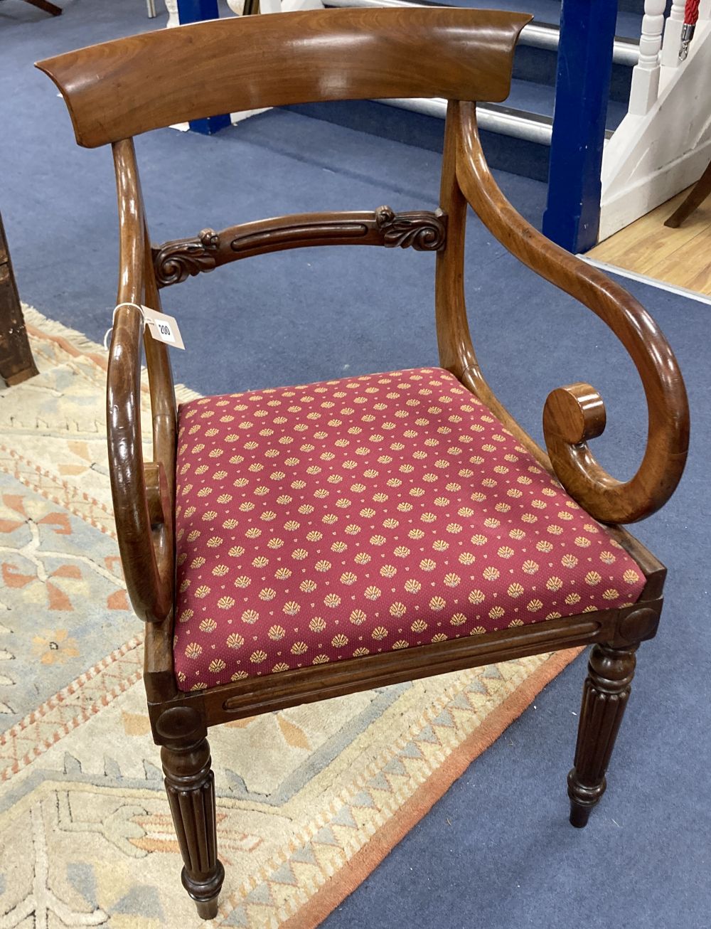 A William IV scroll arm elbow chair